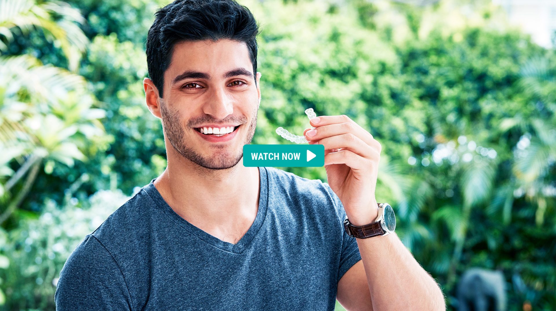 Guy holding EZ SMILE aligner